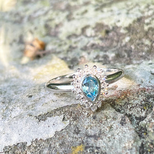 Radiant Pear Cut Blue Topaz with Diamond Halo Ring