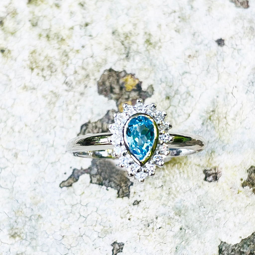 Radiant Pear Cut Blue Topaz with Diamond Halo Ring