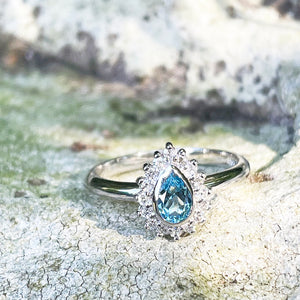 Radiant Pear Cut Blue Topaz with Diamond Halo Ring