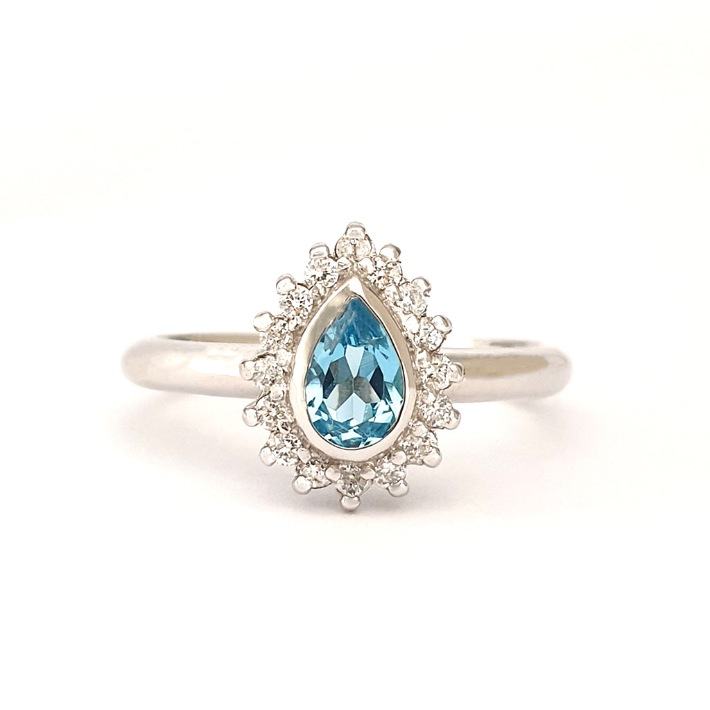 Radiant Pear Cut Blue Topaz with Diamond Halo Ring