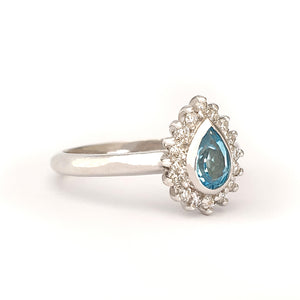 Radiant Pear Cut Blue Topaz with Diamond Halo Ring