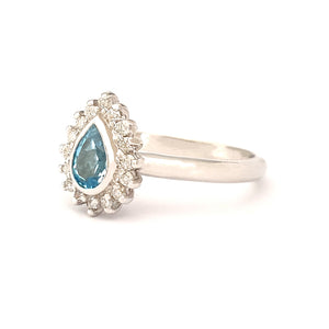 Radiant Pear Cut Blue Topaz with Diamond Halo Ring