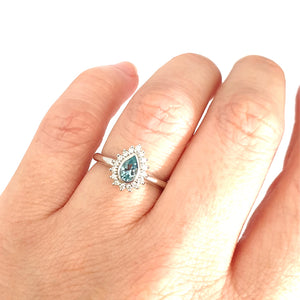 Radiant Pear Cut Blue Topaz with Diamond Halo Ring