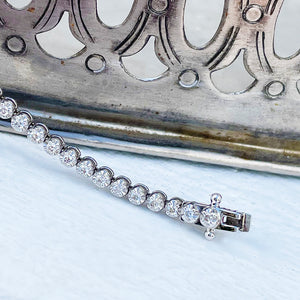 Raised Four Claw 1ct White Diamond White Gold Tennis Bracelet