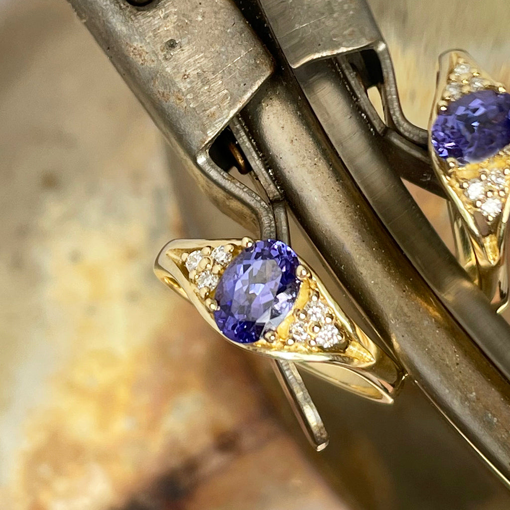 Regal Oval Tanzanite and Trilogy Diamond Shouldered Yellow Gold Ring