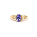 Regal Oval Tanzanite and Trilogy Diamond Shouldered Yellow Gold Ring