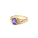 Regal Oval Tanzanite and Trilogy Diamond Shouldered Yellow Gold Ring