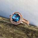 Rose Gold London Blue Topaz Ring with Diamond Halo and Band Accents