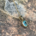 Round Bezel Set Blue Topaz with Fixed Bale Yellow Gold Pendant And Chain