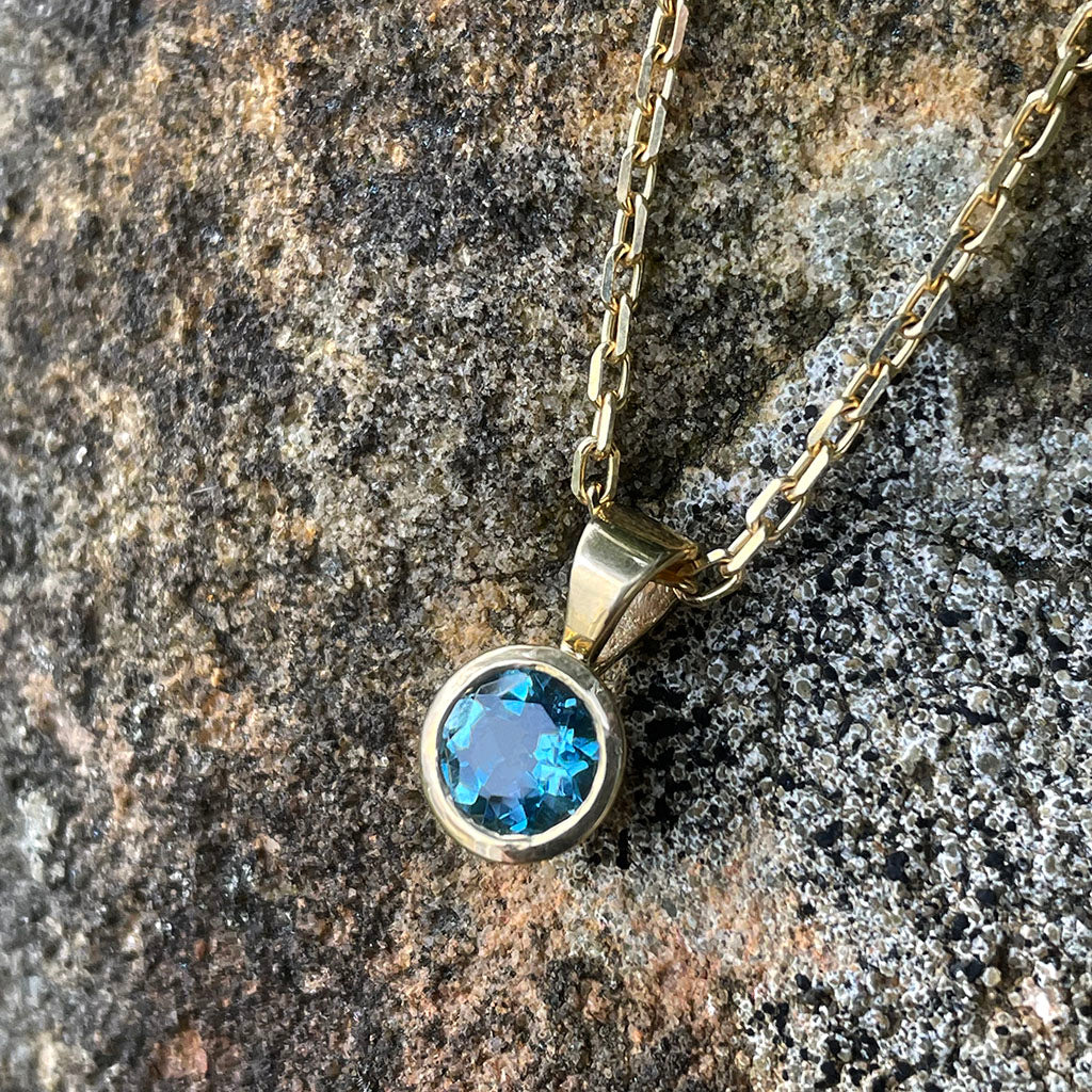 Round Bezel Set Blue Topaz with Fixed Bale Yellow Gold Pendant And Chain
