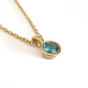Round Bezel Set Blue Topaz with Fixed Bale Yellow Gold Pendant And Chain