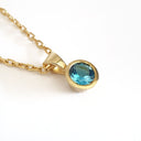 Round Bezel Set Blue Topaz with Fixed Bale Yellow Gold Pendant And Chain