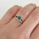 Solitaitre Round Cut and Claw Blue Topaz Yellow Gold Ring
