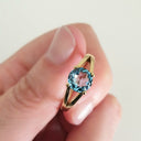 Solitaitre Round Cut and Claw Blue Topaz Yellow Gold Ring