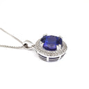 Scintillating Tanzanite and Double Diamond Halo Pendant