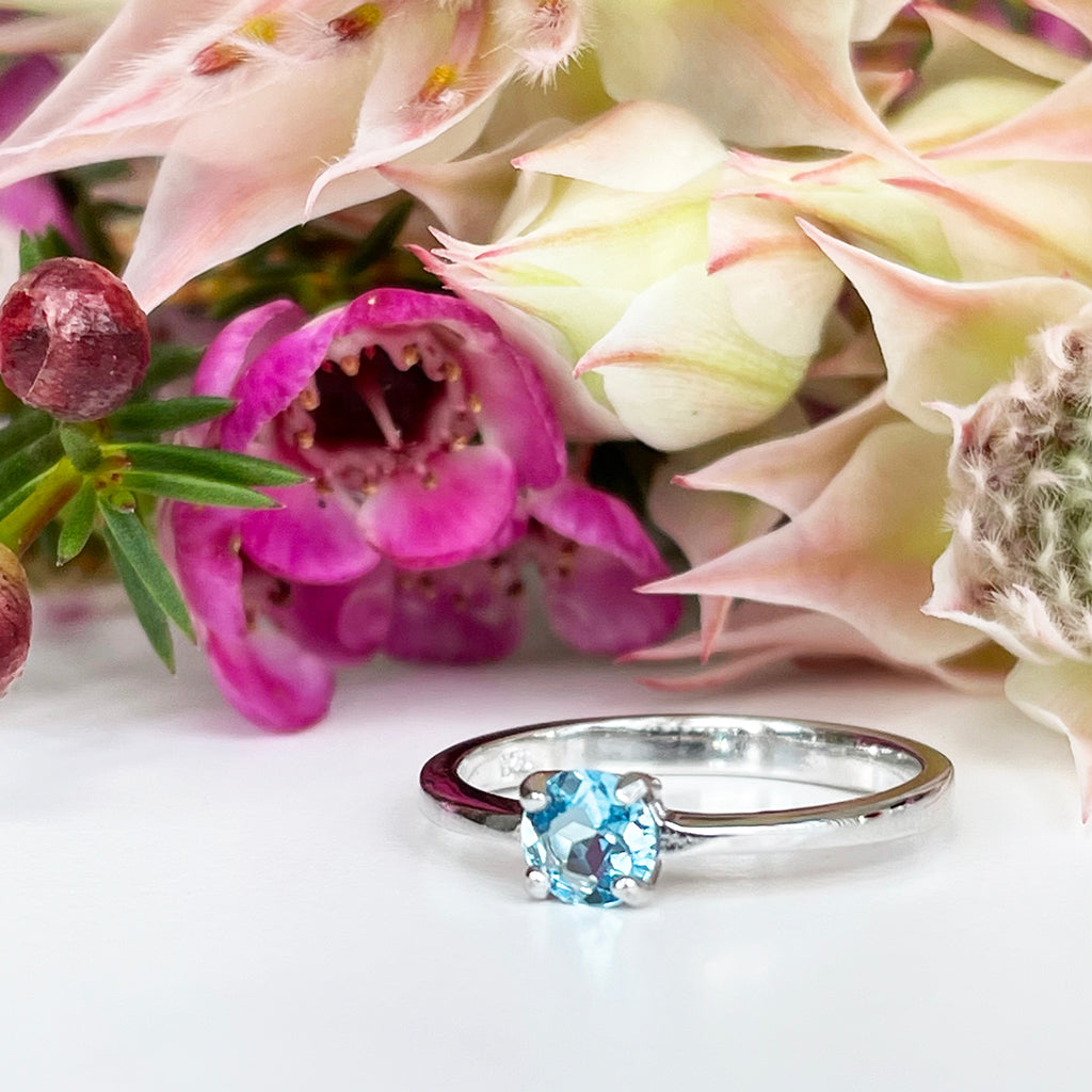 Silver Four Claw Solitaire Blue Topaz Round Cut Ring