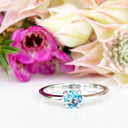 Silver Four Claw Solitaire Blue Topaz Round Cut Ring