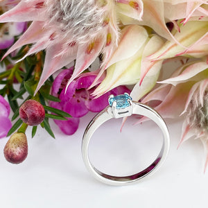 Silver Four Claw Solitaire Blue Topaz Round Cut Ring