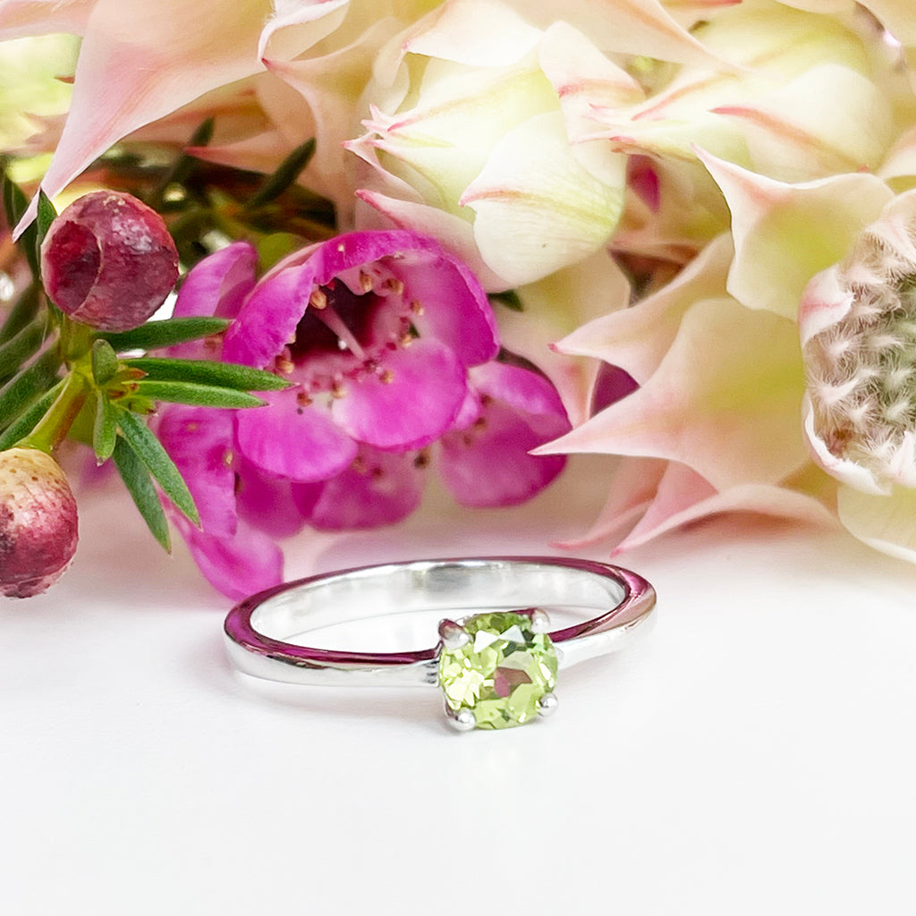 Silver Four Claw Solitaire Peridot Round Cut Ring