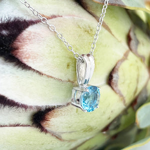 Silver Grooved Bale Round Blue Topaz Pendant