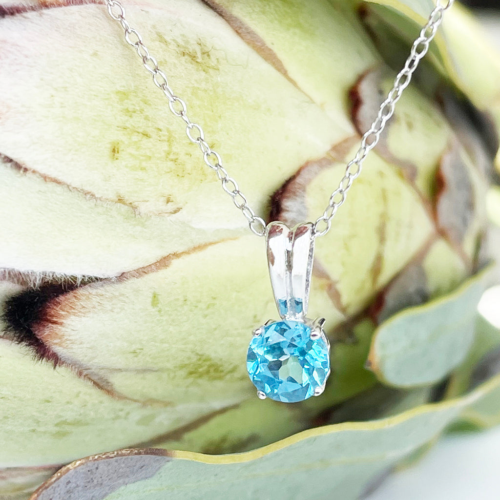 Silver Grooved Bale Round Blue Topaz Pendant