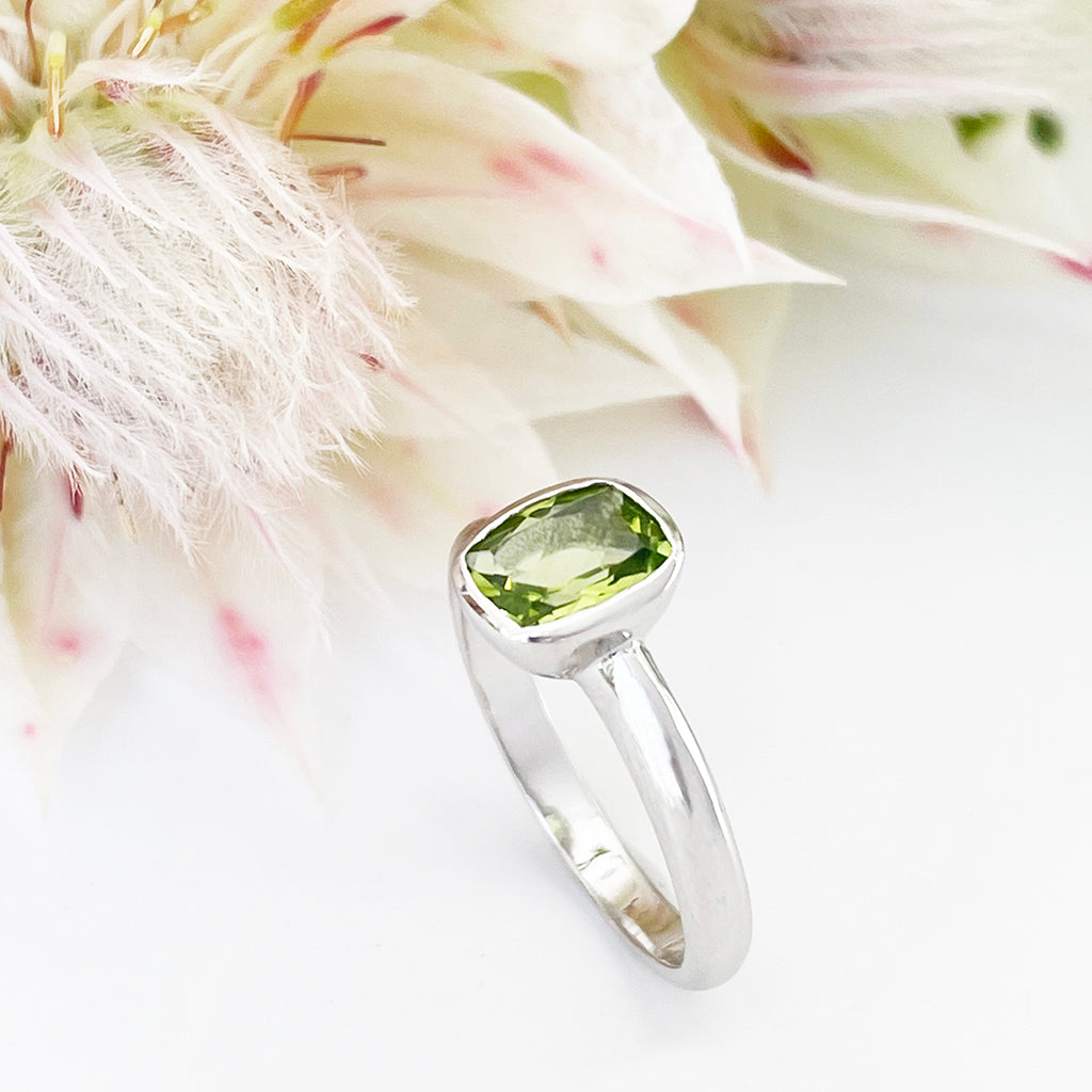 Silver Elongated Cushion Bezel Set Peridot Ring