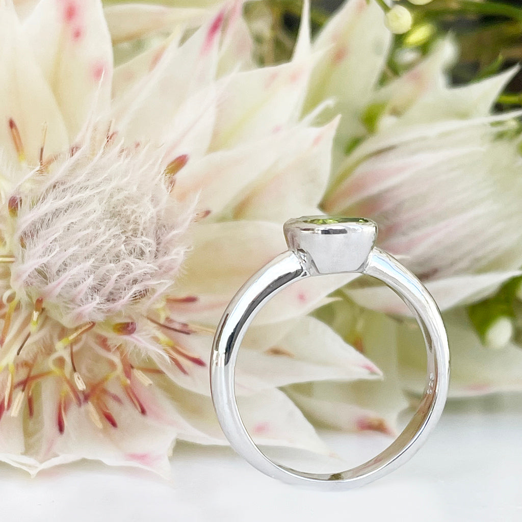 Silver Elongated Cushion Bezel Set Peridot Ring