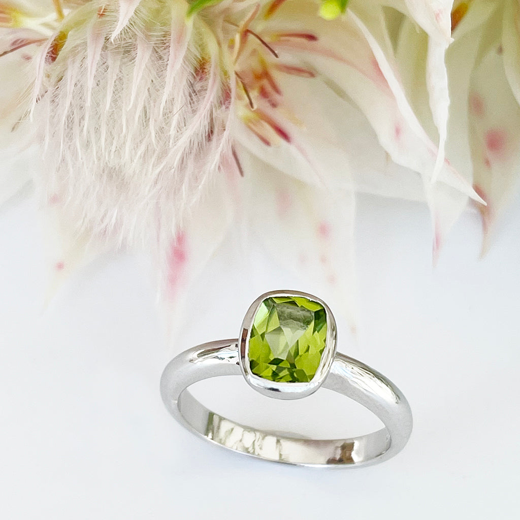 Silver Elongated Cushion Bezel Set Peridot Ring