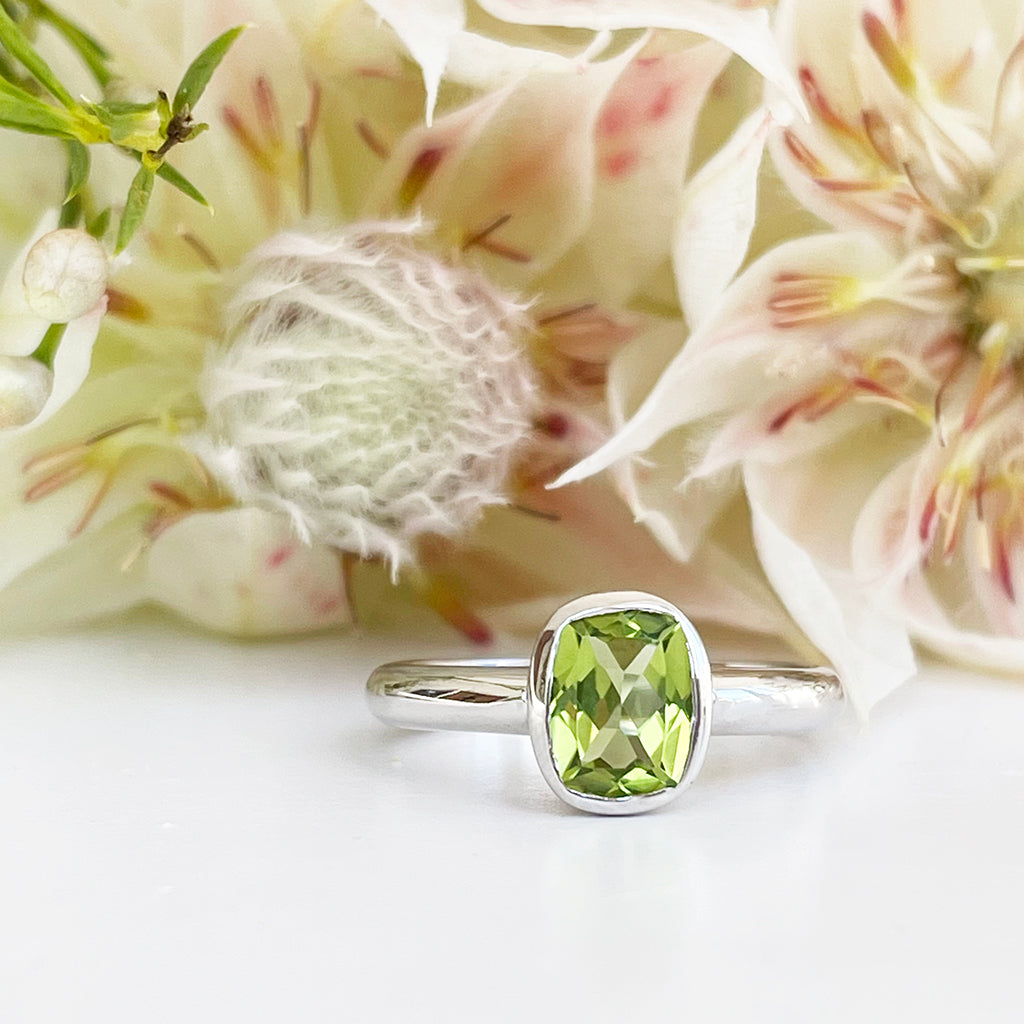 Silver Elongated Cushion Bezel Set Peridot Ring