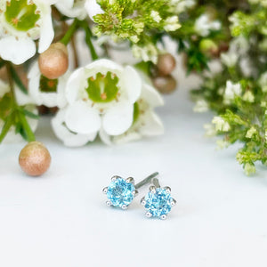 Silver Petite 6 Claw Blue Topaz Studs