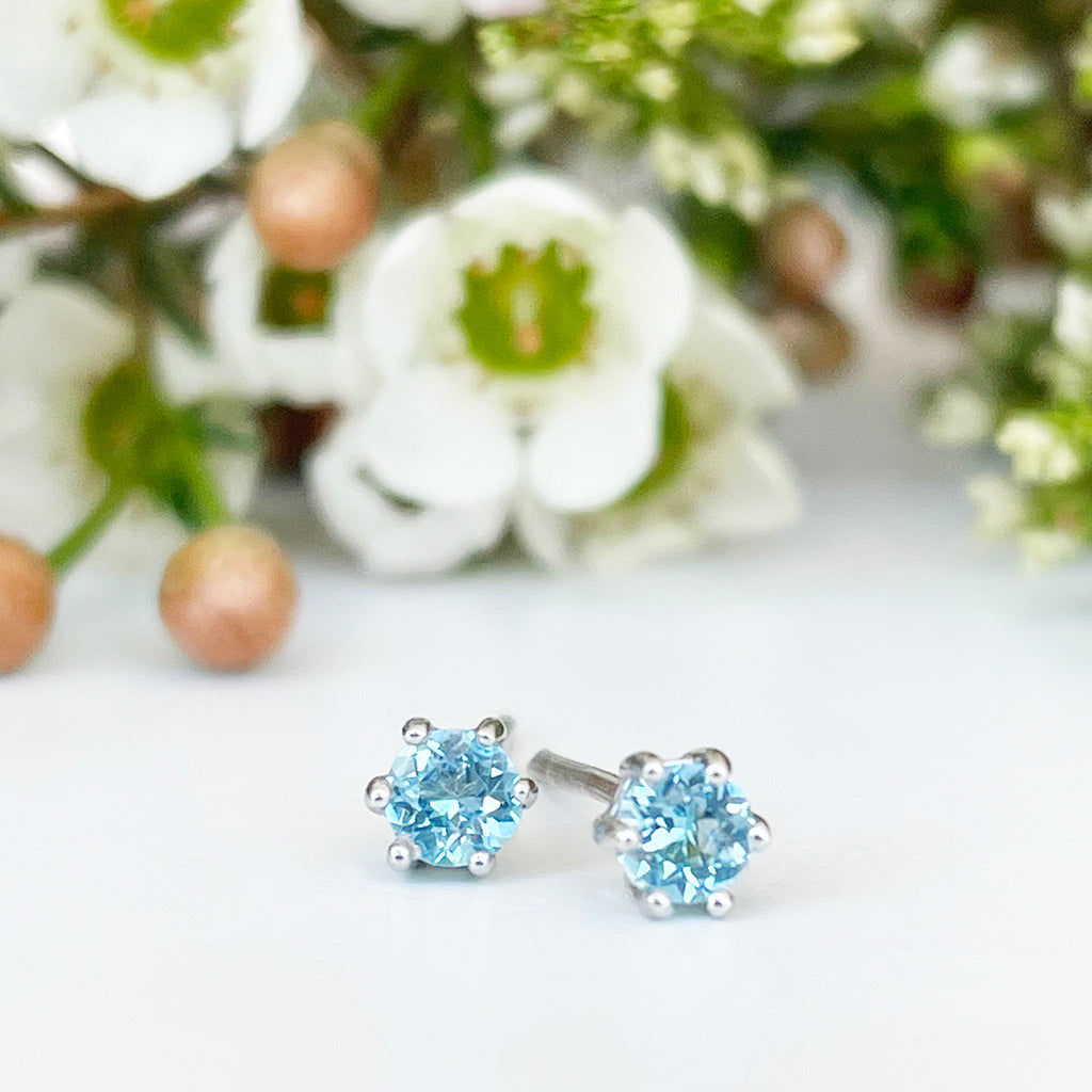 Silver Petite 6 Claw Blue Topaz Studs