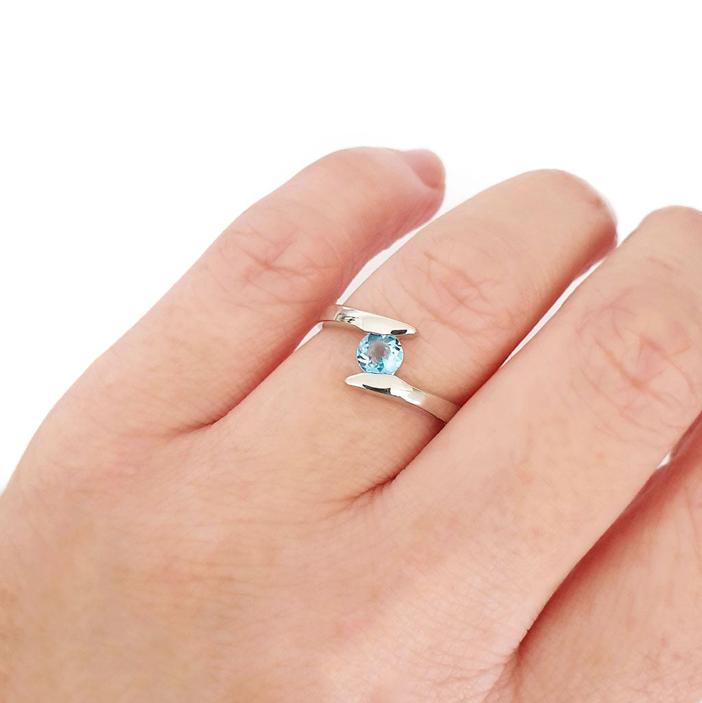 Silver Round Cut Blue Topaz Twist Ring