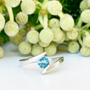 Silver Round Cut Blue Topaz Twist Ring