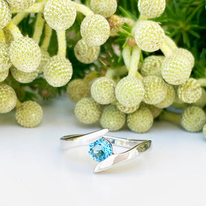 Silver Round Cut Blue Topaz Twist Ring