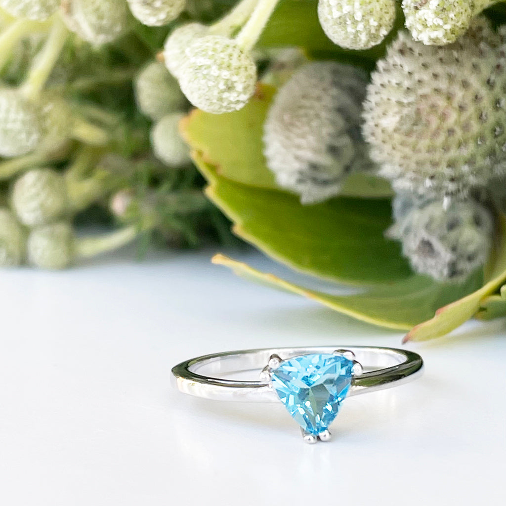 Silver Solitaire Blue Topaz Trilliant Cut Ring