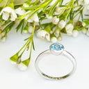 Silver Solitaire Round Tube Set Blue Topaz Ring