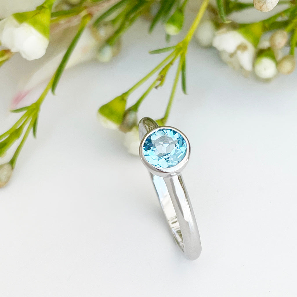 Silver Solitaire Round Tube Set Blue Topaz Ring