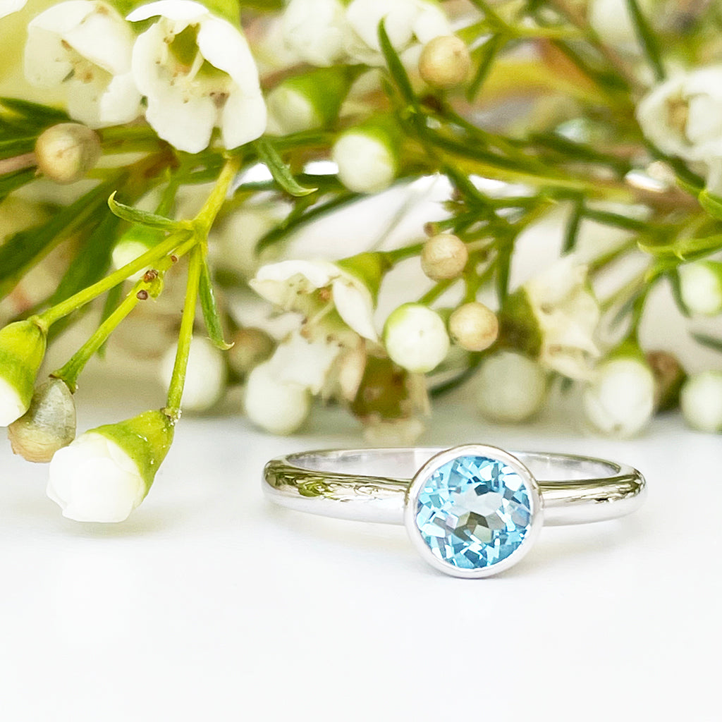 Silver Solitaire Round Tube Set Blue Topaz Ring