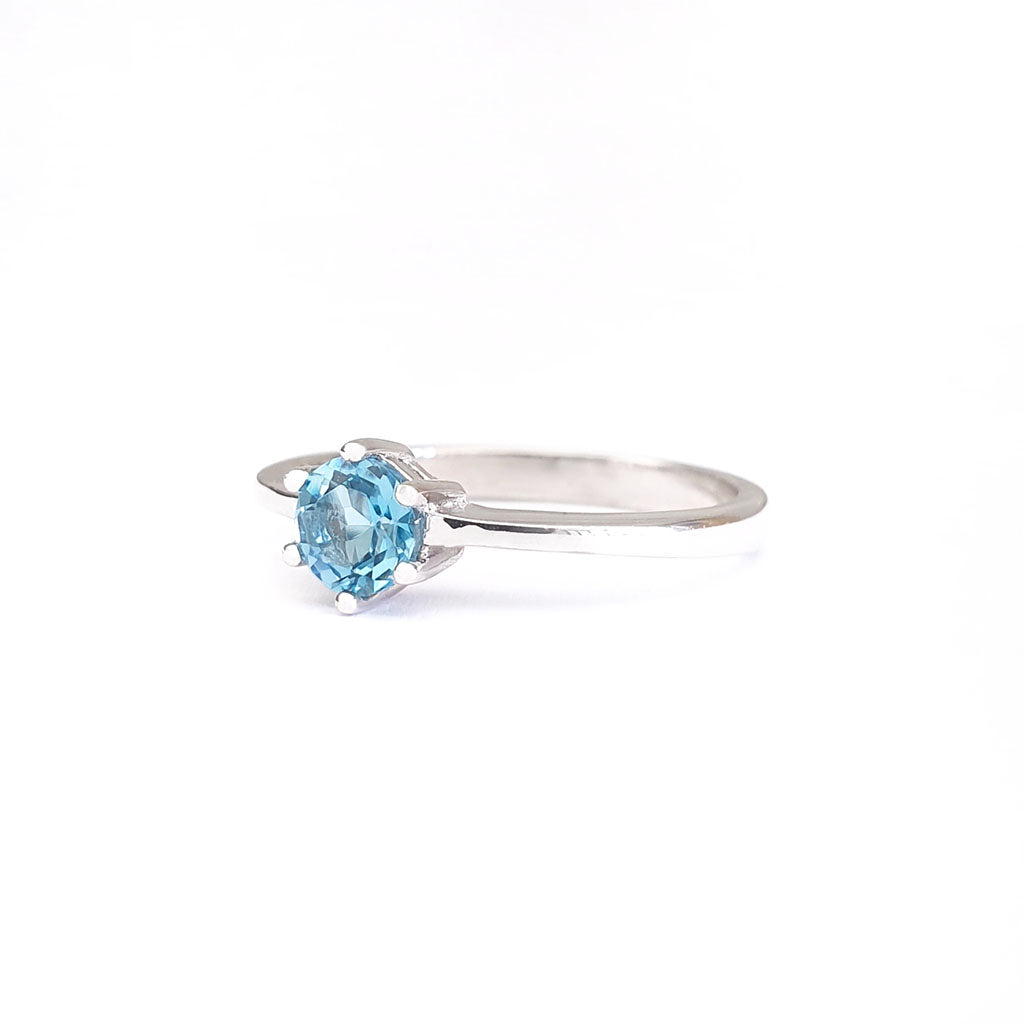 Silver Solitaire Six Claw Blue Topaz Ring