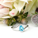 Silver Swish Pear Cut Blue Topaz Ring