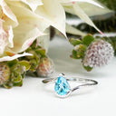 Silver Swish Pear Cut Blue Topaz Ring