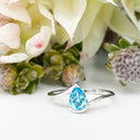 Silver Swish Pear Cut Blue Topaz Ring