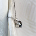 Four Claw Solitaire Black Diamond and White Gold Pendant