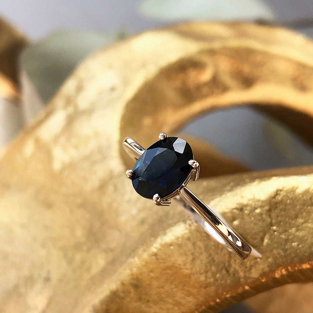 Solitaire Oval Faceted Four Claw Sapphire Ring
