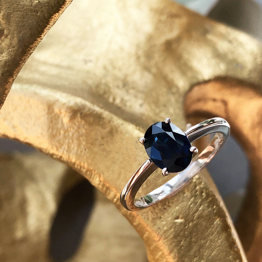 Solitaire Oval Faceted Four Claw Sapphire Ring
