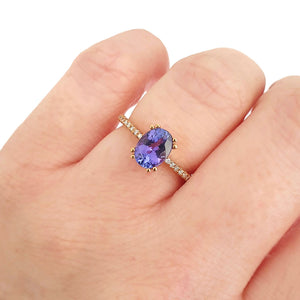 Sophisticated Oval Tanzanite with Diamond Band Rose Gold Ring