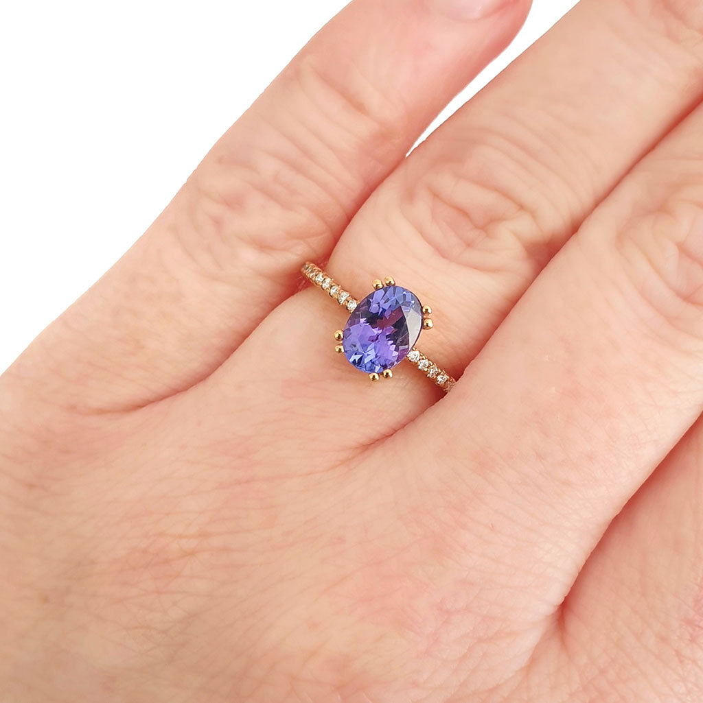 Sophisticated Oval Tanzanite with Diamond Band Rose Gold Ring