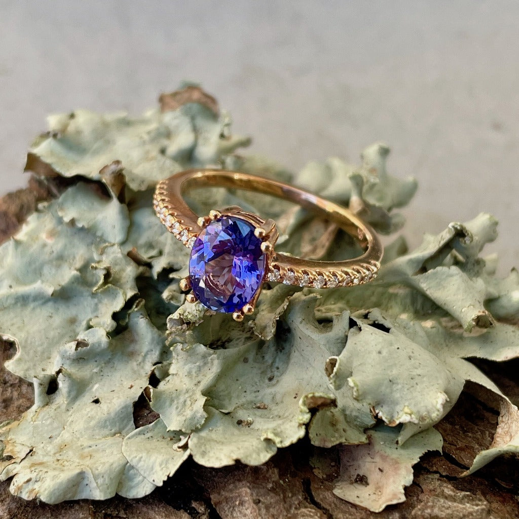 Sophisticated Oval Tanzanite with Diamond Band Rose Gold Ring