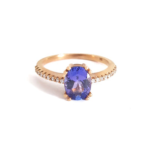 Sophisticated Oval Tanzanite with Diamond Band Rose Gold Ring