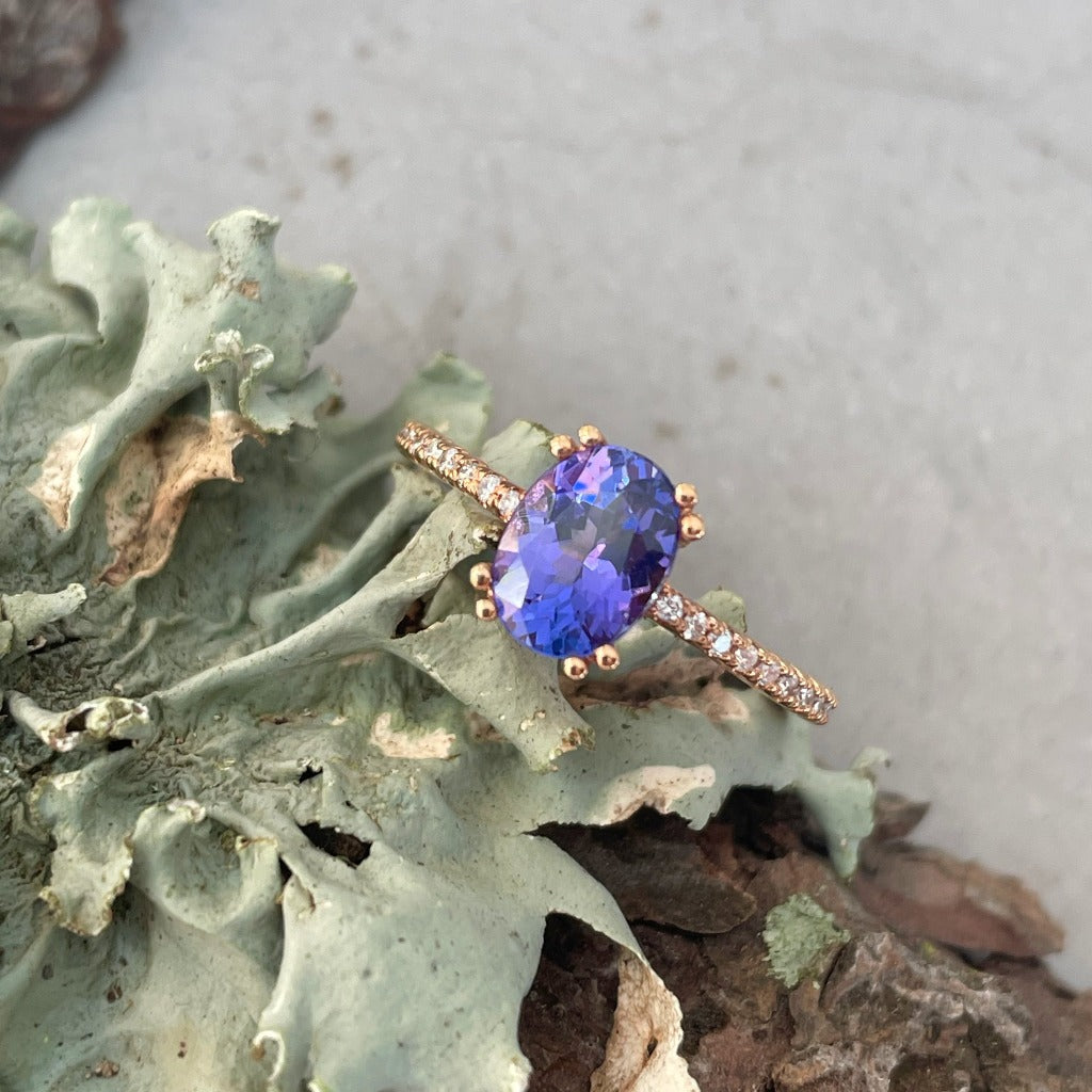 Sophisticated Oval Tanzanite with Diamond Band Rose Gold Ring